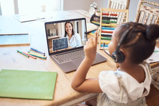 Student attending online tuition session at home